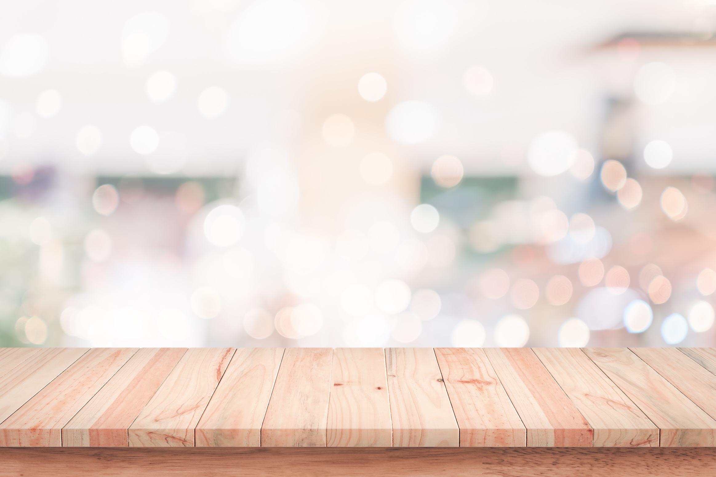 Empty wood table with blur cafe background.